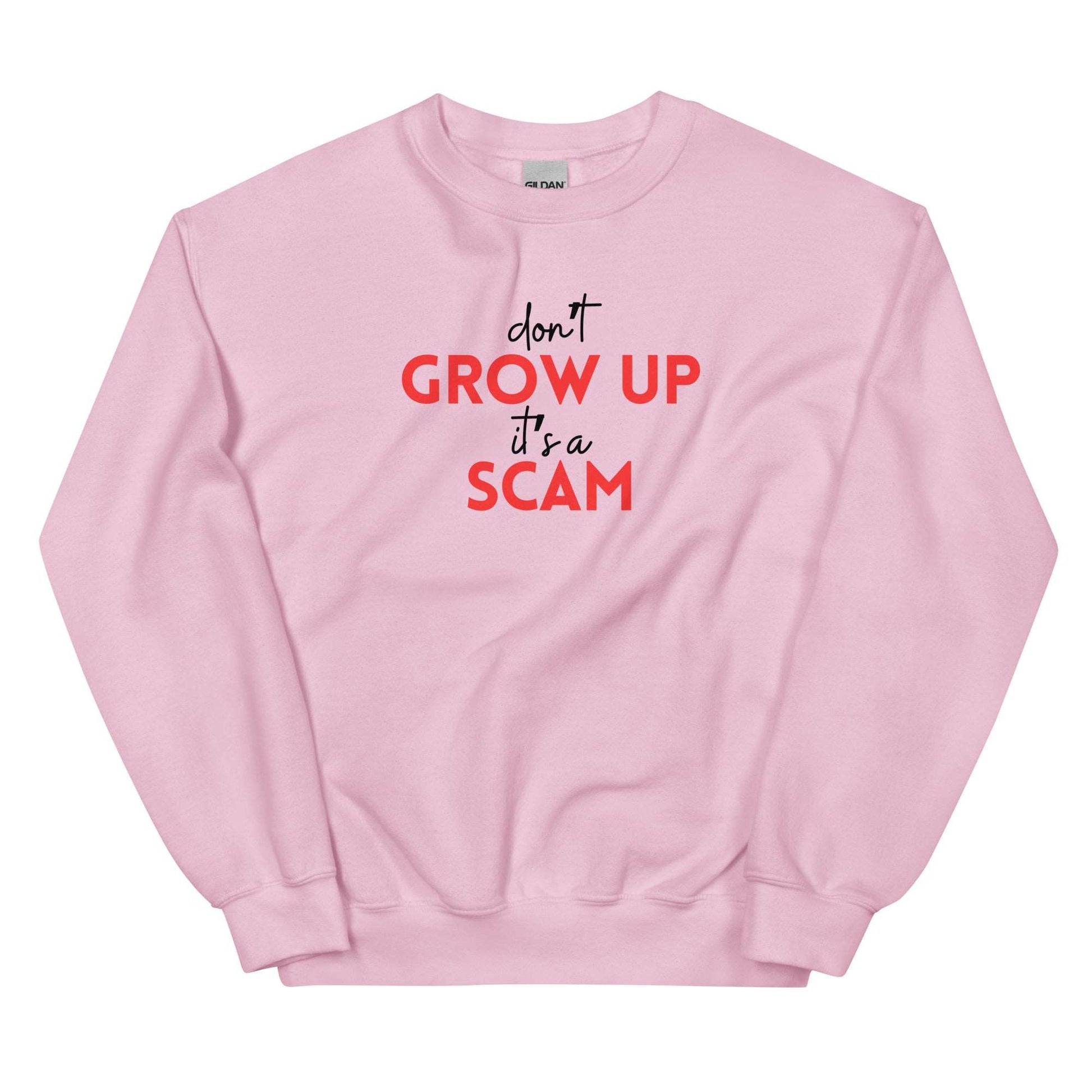 DON'T GROW UP IT'S A SCAM - Unisex Sweatshirt